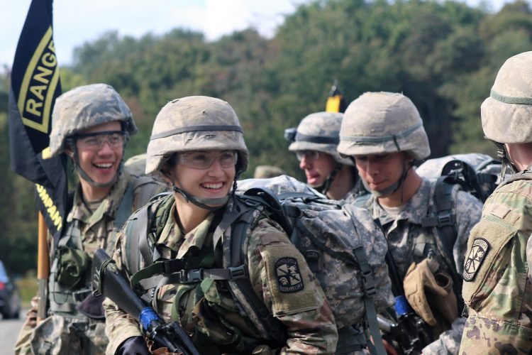 Ranger Challenge Cadets smile after completing a foot march