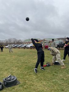Cadet performs the Standing-Power-Throw event during the ACFT